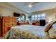 Inviting bedroom offering a comfortable bed, dresser, and large window with bright natural lighting at 8198 Terrace Garden N Dr # 109, St Petersburg, FL 33709