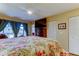 Well-lit bedroom featuring wood floors, access to the sunroom, and a ceiling fan at 8198 Terrace Garden N Dr # 109, St Petersburg, FL 33709
