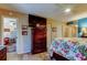 Bedroom with wood floors, a dresser, and access to other rooms in the house at 8198 Terrace Garden N Dr # 109, St Petersburg, FL 33709