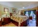 Spacious bedroom with a ceiling fan, wood floors, and access to an outdoor area at 8198 Terrace Garden N Dr # 109, St Petersburg, FL 33709
