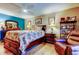 A spacious bedroom showcasing wood floors, dresser, and matching bedside tables at 8198 Terrace Garden N Dr # 109, St Petersburg, FL 33709