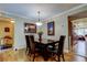 Dining room featuring a dark wood table with leather chairs and modern lighting at 8198 Terrace Garden N Dr # 109, St Petersburg, FL 33709