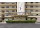 A full exterior view of a building with the USA flag hanging on the side at 8198 Terrace Garden N Dr # 109, St Petersburg, FL 33709