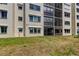 Low angle view of the exterior featuring multiple screened terraces and windows for bright sunlight at 8198 Terrace Garden N Dr # 109, St Petersburg, FL 33709