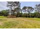 Park like setting with mature trees and an accent wall at 8198 Terrace Garden N Dr # 109, St Petersburg, FL 33709