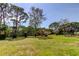 Well maintained community grounds with grassy areas and mature landscaping at 8198 Terrace Garden N Dr # 109, St Petersburg, FL 33709