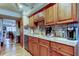 Updated kitchen features granite countertops, stainless appliances, and wood cabinetry at 8198 Terrace Garden N Dr # 109, St Petersburg, FL 33709