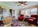 Comfortable living room with two red chairs and lots of natural light at 8198 Terrace Garden N Dr # 109, St Petersburg, FL 33709