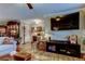 Spacious living room with stylish decor, hardwood floors, and plenty of seating at 8198 Terrace Garden N Dr # 109, St Petersburg, FL 33709