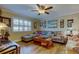 Cozy living room featuring a comfortable sectional sofa and a ceiling fan at 8198 Terrace Garden N Dr # 109, St Petersburg, FL 33709