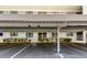 Assigned parking space in a covered carport, with well-maintained landscaping at 8198 Terrace Garden N Dr # 109, St Petersburg, FL 33709