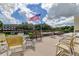 Community outdoor patio, with seating area and well-kept greenery at 8198 Terrace Garden N Dr # 109, St Petersburg, FL 33709