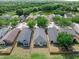 Aerial view of the property surrounded by lush greenery and trees at 8420 Deer Chase Dr, Riverview, FL 33578