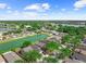 Aerial view of neighborhood featuring the property, pond, and other residential homes in a suburban community at 8420 Deer Chase Dr, Riverview, FL 33578