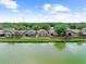 View of backyard overlooking pond with lush green grass and a serene atmosphere at 8420 Deer Chase Dr, Riverview, FL 33578