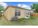 Backyard view of the property showing the siding, windows, sliding glass doors and the air conditioning condenser at 8420 Deer Chase Dr, Riverview, FL 33578