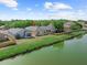 The backyard has a pond view and lush green grass, creating a tranquil escape at 8420 Deer Chase Dr, Riverview, FL 33578