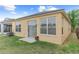 Backyard view of the property showing the siding, windows, sliding glass doors and the air conditioning condenser at 8420 Deer Chase Dr, Riverview, FL 33578