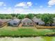 Backyard view overlooking pond and lush green grass with a relaxing atmosphere at 8420 Deer Chase Dr, Riverview, FL 33578