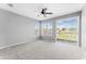 Spacious bedroom filled with natural light from windows and sliding glass door at 8420 Deer Chase Dr, Riverview, FL 33578