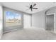 Bright bedroom with window view; features ceiling fan and neutral carpeting at 8420 Deer Chase Dr, Riverview, FL 33578
