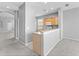 Open kitchen with breakfast bar and modern appliances, seamlessly connecting to living space at 8420 Deer Chase Dr, Riverview, FL 33578