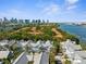 Aerial view of a beautiful community with a waterfront view and city skyline in the background at 916 Hemingway Cir, Tampa, FL 33602
