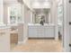 Bathroom with dual sinks, tile floors, and a large soaking tub at 916 Hemingway Cir, Tampa, FL 33602