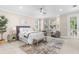 Bright bedroom featuring bay window, ceiling fan, and sitting area at 916 Hemingway Cir, Tampa, FL 33602