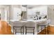 Bright kitchen features white cabinets, stone countertops and bar seating at 916 Hemingway Cir, Tampa, FL 33602