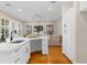 Open living space featuring hardwood floors connecting the kitchen and Gathering room at 916 Hemingway Cir, Tampa, FL 33602