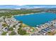 Expansive aerial shot of a community surrounding a large, serene lake, with homes and lush greenery at 9416 Star Gazer Ln, Riverview, FL 33578