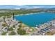 This aerial view highlights the property's prime waterfront location with community pool and surrounding neighborhood at 9416 Star Gazer Ln, Riverview, FL 33578