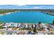 Aerial view of lakeside homes, showcasing a community with well-maintained properties and serene water views at 9416 Star Gazer Ln, Riverview, FL 33578