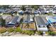 Aerial view showcasing the home's backyard, landscaping, and lakeside location within the community at 9416 Star Gazer Ln, Riverview, FL 33578