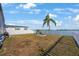 This backyard has a fire pit, a grilling station, water view, and is fully fenced at 9416 Star Gazer Ln, Riverview, FL 33578