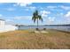 Backyard with lake view and seating at 9416 Star Gazer Ln, Riverview, FL 33578