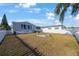 This backyard offers a fire pit, a grilling station, and ample space for relaxation at 9416 Star Gazer Ln, Riverview, FL 33578