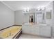 Bright bathroom features a soaking tub, vanity with double sinks, and great lighting at 9416 Star Gazer Ln, Riverview, FL 33578