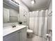 Well-lit bathroom with white vanity, and neutral color scheme offers a clean and modern aesthetic at 9416 Star Gazer Ln, Riverview, FL 33578