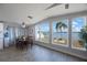 Cozy dining room with a view of the beautiful lake and a well-manicured backyard at 9416 Star Gazer Ln, Riverview, FL 33578