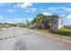 Exterior street view of a cozy home showcasing well-maintained landscaping and a welcoming neighborhood at 9416 Star Gazer Ln, Riverview, FL 33578