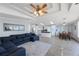 Open floor plan featuring a living room, kitchen, and dining area with wood floors and modern lighting at 9416 Star Gazer Ln, Riverview, FL 33578