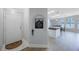 Open-concept living space with water views, leading to the kitchen, dining, and entry way at 9416 Star Gazer Ln, Riverview, FL 33578