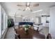 Bright and airy living space with a large dining table and an open view of the living room area at 9416 Star Gazer Ln, Riverview, FL 33578