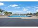 Community pool featuring crystal-clear water, lounge chairs and gorgeous views of the surrounding nature at 9416 Star Gazer Ln, Riverview, FL 33578