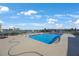 Enjoy the community pool with comfortable lounge chairs for sunny relaxation by the beautiful waterfront at 9416 Star Gazer Ln, Riverview, FL 33578