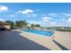 Relax by the sparkling community pool, complete with lounge chairs and tables for ultimate comfort and relaxation at 9416 Star Gazer Ln, Riverview, FL 33578