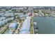 Aerial view of waterfront townhomes with boat docks and close proximity to beach at 100 Windrush Blvd # 1, Indian Rocks Beach, FL 33785