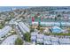 Bright waterfront townhouse with private dock, lush landscaping, and coastal charm in a vibrant community at 100 Windrush Blvd # 1, Indian Rocks Beach, FL 33785